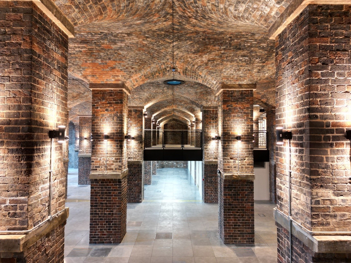 an interior image of the goods ard showing columns and lighting