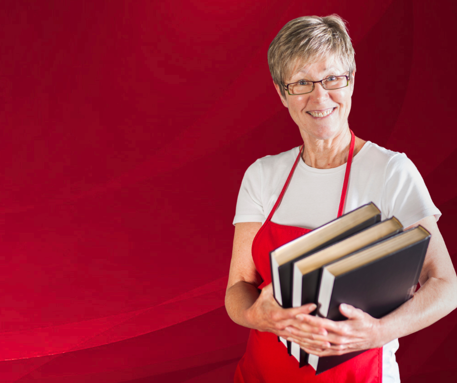 lady standing, holding books 