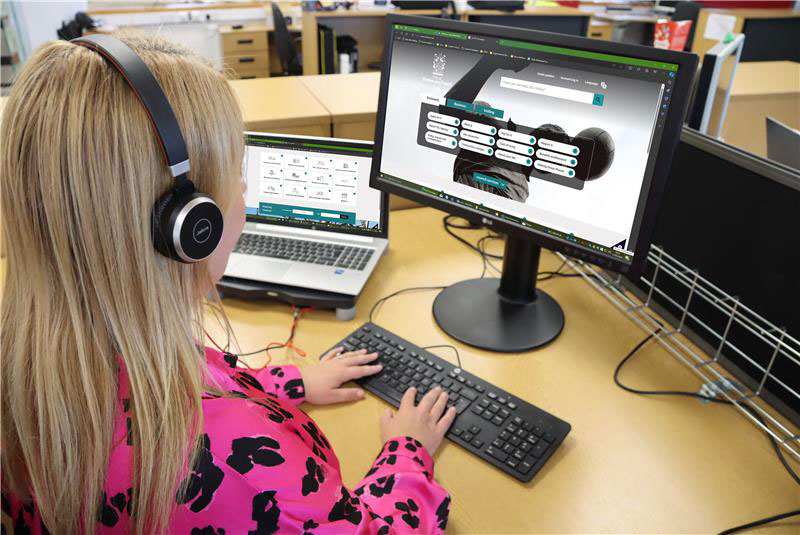 Member of staff typing on computer